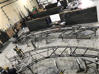 The curved trusses take shape